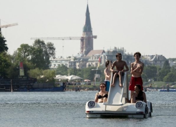 People make their way in pedal boats on the Old Danube (Alte Donnau) (Photo by JOE KLAMAR / AFP)