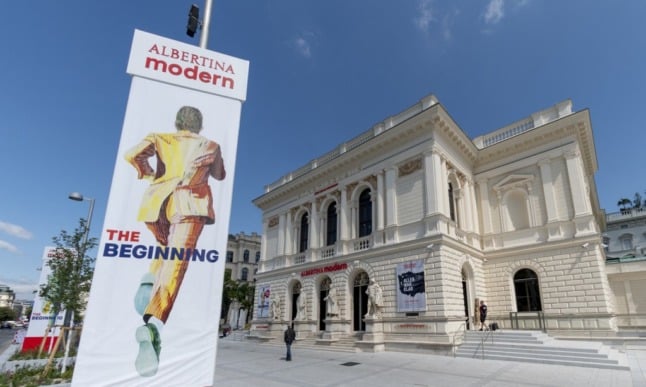 A man passes by the reopened Albertina Modern art museum featuring the exhibition 