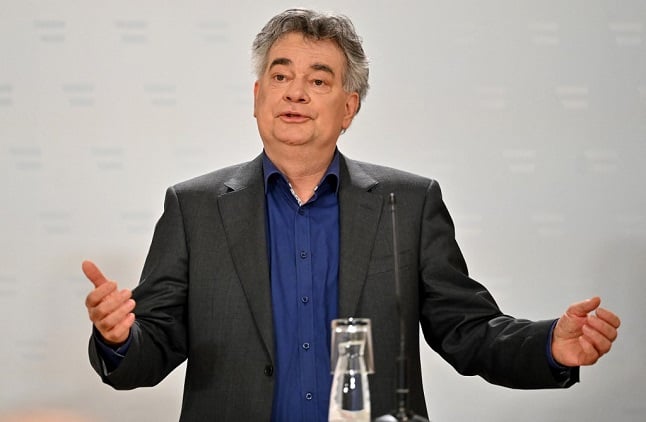 Austria's Vice-Chancellor Werner Kogler gestures as he speaks during a press conference. (Photo by JOE KLAMAR / AFP)