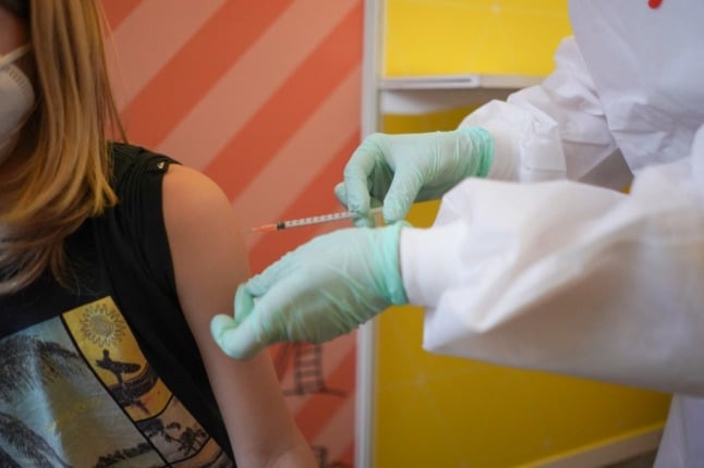 A ten-year-old girl is vaccinated against Covid-19 at a vaccination centre for children at the museum of natural history in Berlin, on December 15th 2021. Photo: Jörg Carstensen/AFP